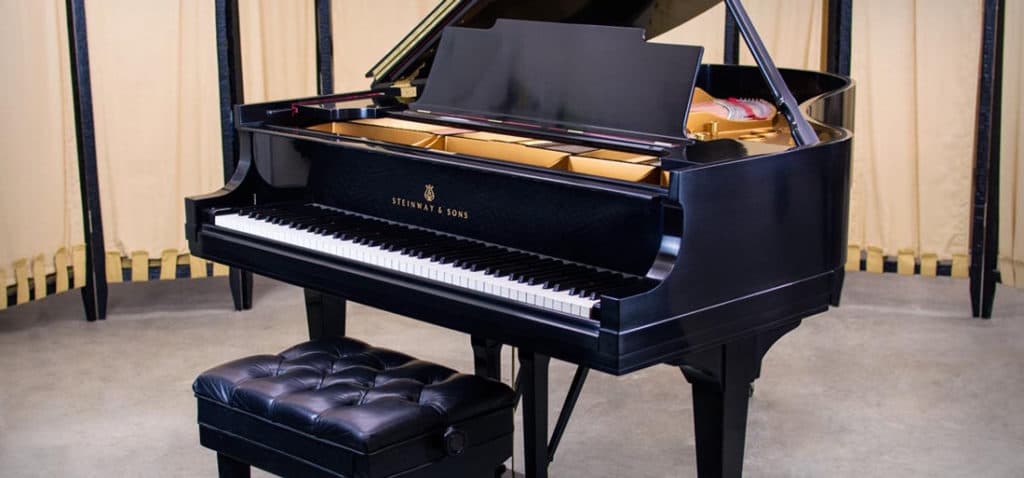 11 medium grand pianos