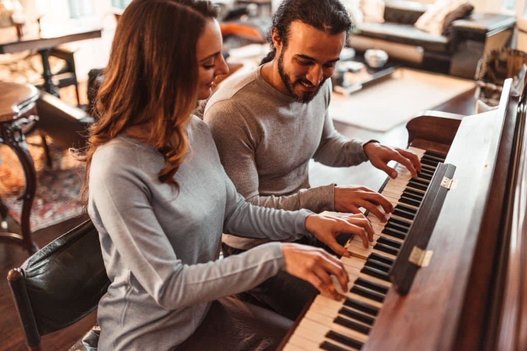 couple playing piano